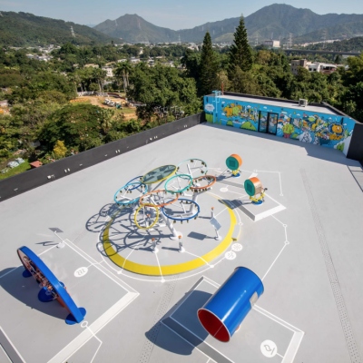 The energy-themed playground is on the rooftop of a training camp site and surrounded by lush greenery.