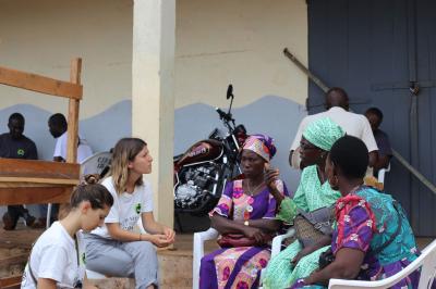 From left to right: Fair Trade USA's Gesina Beckert and Sadie Morgan listen as Zaté Virginie, Kakou Micheline, and Kooyone Affia, three fair trade cocoa producers and COOPATESA cooperative committee members, share about the challenges of cocoa farming.
