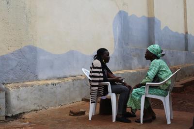 Kakou Micheline (right) shares her experiences with a translator about the changes fair trade has brought about in her cooperative.