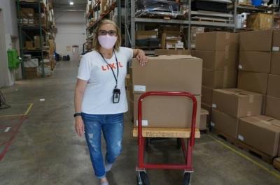 LIXIL employee Debbie Drury distributes face shields at the company’s headquarters in Piscataway, N.J. to LIXIL employees across the country to distribute in their respective communities. Piscataway-based LIXIL, home to the kitchen and bath brand American Standard, recently expanded their efforts to make face shields for front line workers and teamed up with a local volunteer group called Jersey City Rapid Maker Response Group (JCRMRG) to manufacture and distribute thousands of face shields to first responders and medical workers in communities across the US battling COVID-19. LIXIL is donating 50,000 shields to communities it serves both in its backyard in NJ and across the U.S.