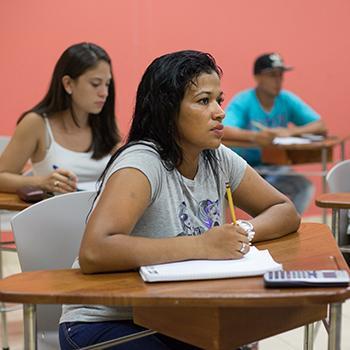 Deysi Baldonado takes a high school certification math course at the community center in Costa Rica.