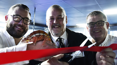 The cutting of the ribbon in January 2020. Mike Dixon (left), Wolverhampton City Council Leader Ian Brookfield (middle) and Ian Dixon (right). And the star of the show, “Rusty” the Panther Chameleon, one of the therapy animals.