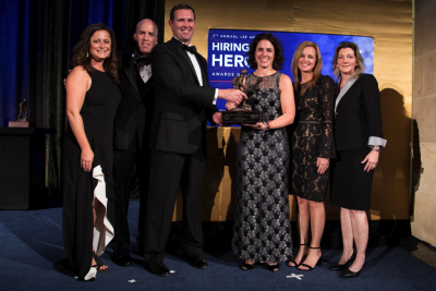 Photographer: Ian Wagreich. Pictured, left to right: Liz O’Brien, Director, Military Spouse Program Hiring Our Heroes; Adam Holton, SVP for Talent Strategy, USAA; Eric Eversole, President, Hiring Our Heroes and Andrea Inserra, SVP, Booz Allen; Aimee-George Leary, SVP, Booz Allen; and Cathy Breeze, VP, Booz Allen.