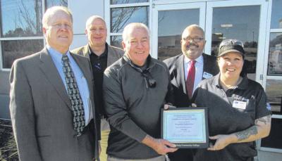 Photo Credit: Charles Warner,The Union Times| Republic Services, LLC Division Manager Tony Davies (center) is presented with a certificate of recognition for Republic in honor of its support of the Spartanburg Community College Union County campus. Over the past two years Republic has provided a total of $40,000 in financial support for the campus through an agreement it has with Union County. The most recent allocation has been used by SCC to add an extension onto the Welding Department of the Union County campus to accommodate the growth of the program and to increase safety. Taking part in the presentation Thursday were SCC President Henry C. Giles Jr. (left), Union County Supervisor Frank Hart (second from left), SCC Union County Campus campus Site Coordinator Isaac McKissick (second from right), and Welding Instructor Cammie Hurst (right).
