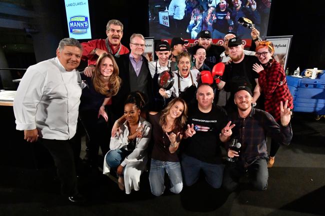 Keira Lombardo, senior vice president of corporate affairs for Smithfield Foods, and Chef Frank Dominguez, corporate chef for Smithfield Foods, join judges, hosts, and competing chefs onstage at DC Central Kitchen's Capital Food Fight on November 16, 2017 at the Ronald Reagan Building in Washington, DC.