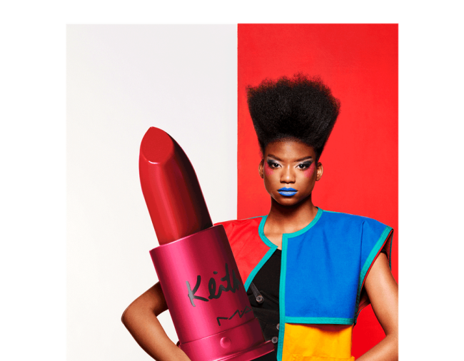 Image courtesy of Elite Daily Person holding an oversized lipstick for display
