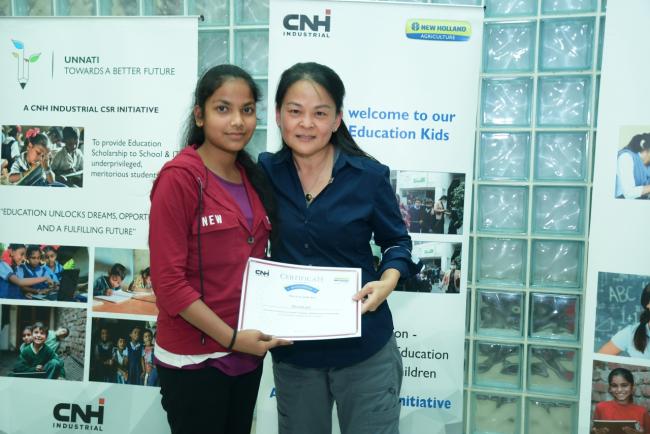 Two women with certificate. 