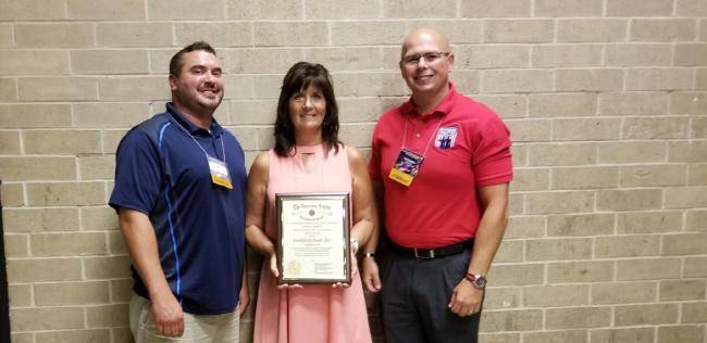 Pictured right to left: Smithfield Foods representatives Randy Koch, operations manager, Michelle Reyburn, human resource manager, and Ted Karagias, corporate continuous improvement manager, accepted the 2018 Employer of the Year Award from The National Veterans Employment & Education Commission on behalf of the company.