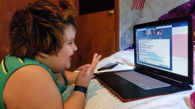 Child using laptop for school