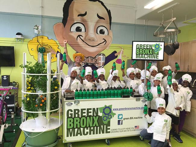 Green Bronx Machine with people surrounding it