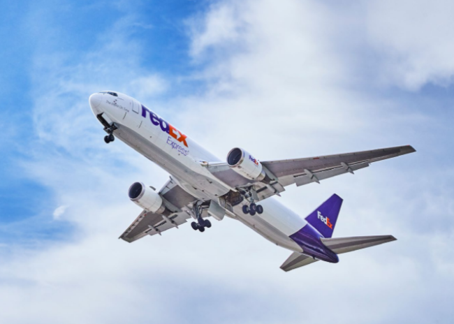 a FedEx Express airplane in the sky