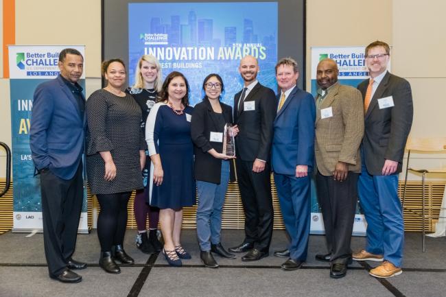 Los Angeles Better Buildings Challenge (LABBC) Executive Director David Hodgins (center right) congratulates the Los Angeles Convention Center team on winning the LABBC Innovation Award for its significant energy savings.