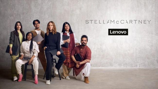 Diverse design students and Stella McCartney holding Lenovo laptops