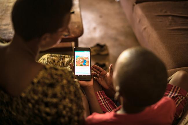 NABU’s mission is to solve the global literacy crisis so all children can read and rise to their full potential. Through mother tongue book creation, tech innovation, and community engagement, NABU is tackling global illiteracy at a scale never before achieved. Kids reading on phone