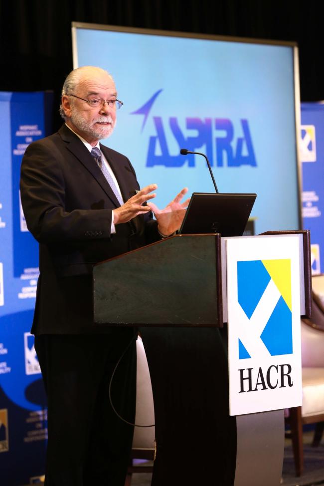 Ronald Blackburn Moreno with HACR logo and Aspira logo behind him