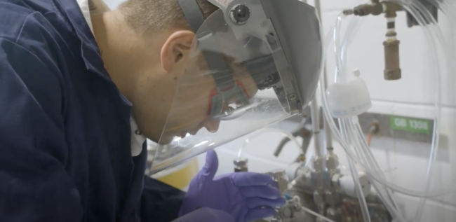 Photo Credit: Lakeland University Person with goggles, gloves and face mask