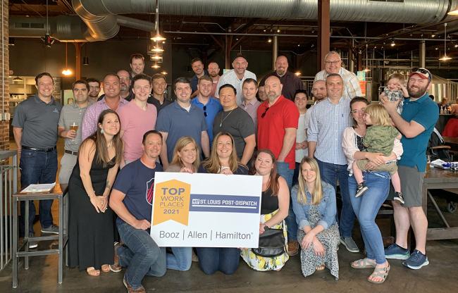 Employees of the Booz Allen St. Louis-O’Fallon Business Center celebrate being named, for the first time ever, one of 2021’s <a href=https://www.stltoday.com/business/workplaces/winners-of-the-2021-top-workplaces-awards/article_e39cad0f-3092-5b50-9c17-ffa717e6f53a.html target="_blank">Top Workplaces in the St. Louis region.</a>