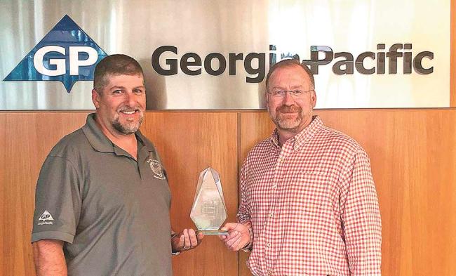 Danny Wright, Diboll Lumber Plant Manager; and Pat Aldred, Vice-President of Composite Panels with award