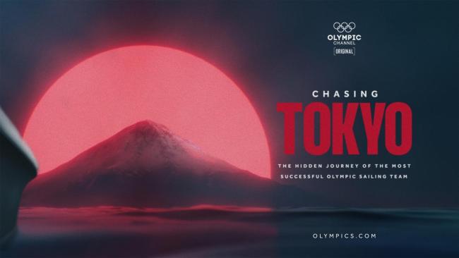 A red sun behind a lone mountain, chasing Tokyo and the olympics symbol on the right
