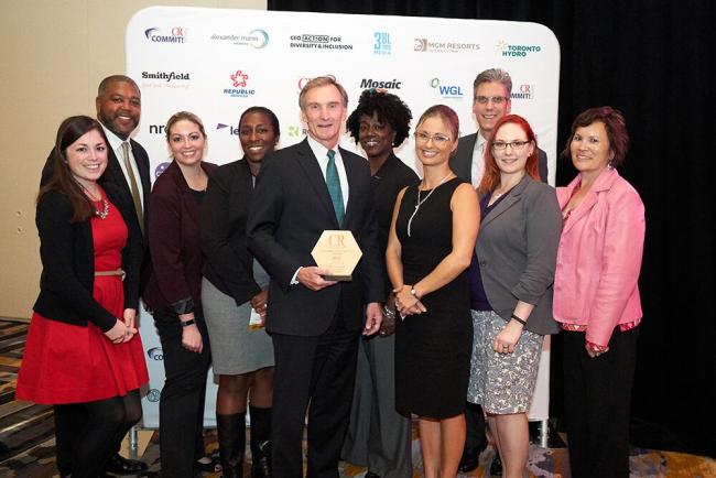 Leidos CEO Roger Krone and team accepting CR Magazine 2017 Responsible CEO award during COMMIT!Forum. The Virginia company is taking a leadership role fighting the opioid epidemic.