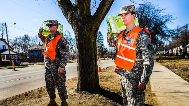 Comcast employee and reservist Kyle Woodard (right) responds to the water crisis in Flint, Michigan.