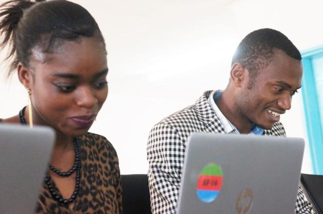 Refugees at the Dzaleka Refugee Camp using HP technology to immerse themselves in the AppFactory Program.