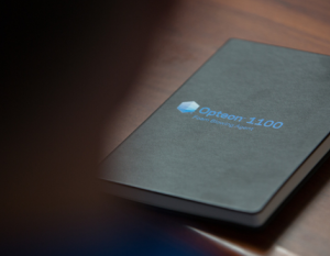a black book with a logo for Opteon 1100 on the cover
