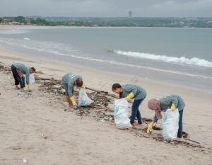 Volunteers with bags of trash cleaned from the beach