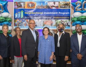 Special guests as part of Fifth Third’s announcement from left to right: Associate Vice President of The Ohio State University Trudy A. Bartley, Near East Side resident and PACT neighborhood board member Lela Boykin, Former Columbus Mayor Michael B. Coleman, Regional President Francie Henry, Congresswoman Joyce Beatty (OH-03), and Fifth Third Central Ohio CED Manager, Sheldon Johnson. Group of people at Columbus Neighborhood Investment Program announcement