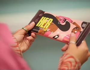 Close of up Hershey bar with the letters "HER" highlighted on the wrapper
