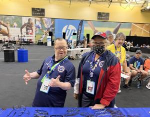 Two Special Olympics participants wearing glasses 