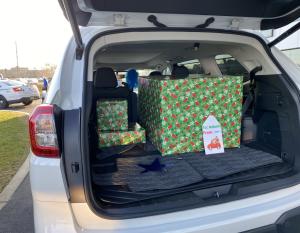A convoy of Subaru vehicles, led by Camden County Police Department, delivered shopping spree wish items outside eight-year-old Camden boy’s home on December 11, 2020. The online shopping spree was granted thanks to support from Subaru through the annual Subaru Share the Love Event. Photo credit: Make-A-Wish