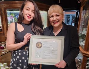 Maiko Eaton, UK Sales Manager at Green Rocks Diamonds and Kay Bradley, Owner of Bradley's Jewellers York and Eco Rocks holding her Accredited Retailer certificate from SCS Global