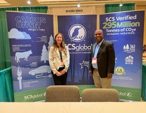 At SCS Global Services' booth at NACW 2022 - Heather Rosa, Program Manager of Energy, Industry and Agriculture and Kenneth Zame, Sales Executive for Carbon Offset Verification