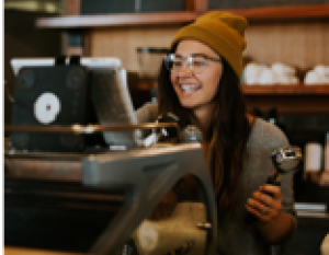 Young female behind a counter.