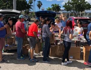 Walgreens team members and their families gather to pack supplies for communities in need.