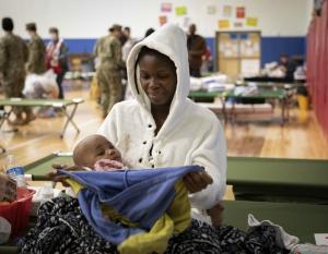 A mother and baby at a Red Cross shelter