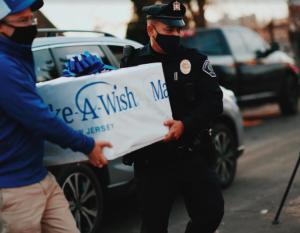 Eight-year-old Antonio, who battles a critical, life-threatening illness, was on the receiving end of a Subaru convoy delivering shopping spree wish items in Camden, NJ. Photo credit: Make-A-Wish