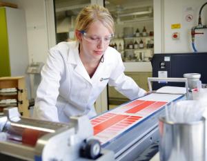 Person in a lab looking at color palettes 