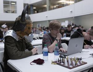 Jordan DeShan won the CodeWars costume contest with a mashup of past Halloween costumes, including a bear mask, Viking hat and shoulder armor made from aluminum cans. Credit Alison Hess