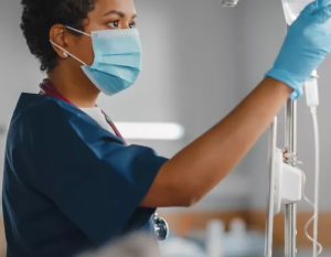 Nurse hanging an IV bag