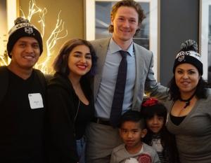 LA Kings forward Tyler Toffoli welcomes families and poses for pictures at the LA Kings Adopt-A-Family event at STAPLES Center on December 9, 2017.