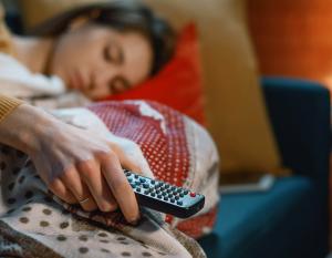 Person asleep with remote