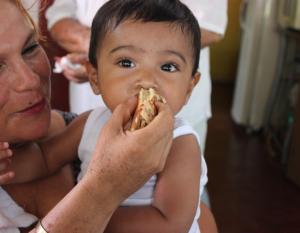 woman feeding baby food
