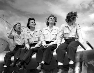 women pilots on wing of plane