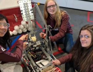 Catherine Gelmini (left) and her robotics teammates take part in the FIRST® Tech Challenge in Canada