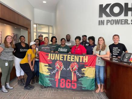group with Juneteeth flag