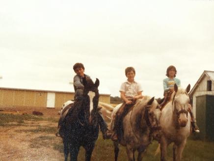 Ramona (right) riding horses with her friends Tom and Chris.