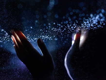 Hands touching water