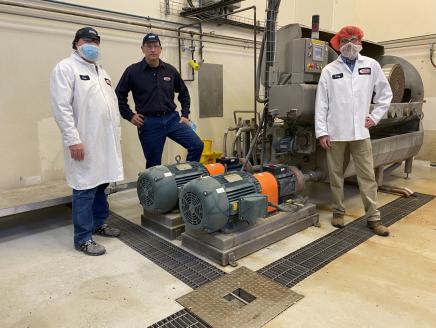 Barilla Plant Director Chris Buseman, Plant Mgr Bill Boula, National Grid Energy Efficiency Specialist Jay Snyder with die wash pump